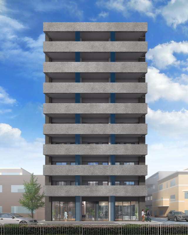 グレーと青を基調とした現代的な外観のマンションの正面ビュー